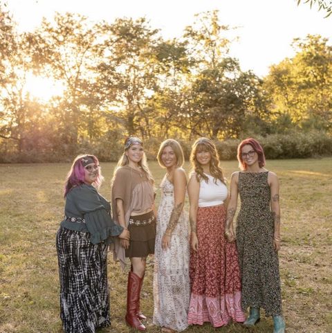 The SpaHub Tulsa team together outdoors at golden hour